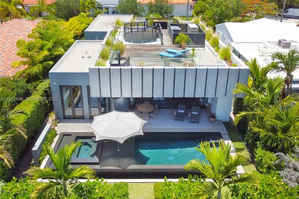 a view of swimming pool with outdoor seating