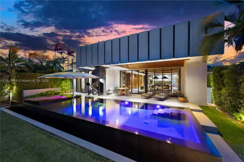 a view of swimming pool with a potted plants