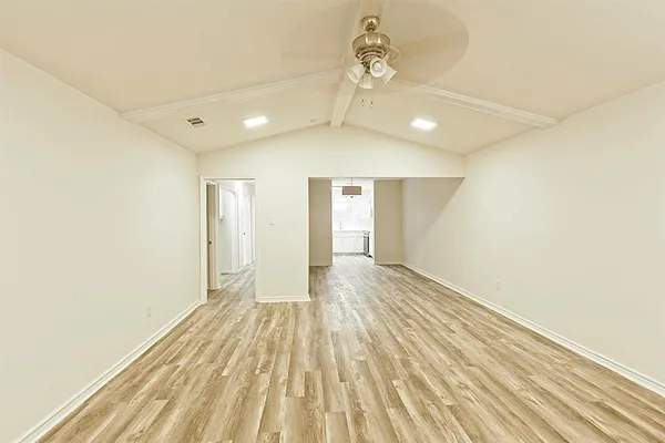a view of a room with a wooden floor