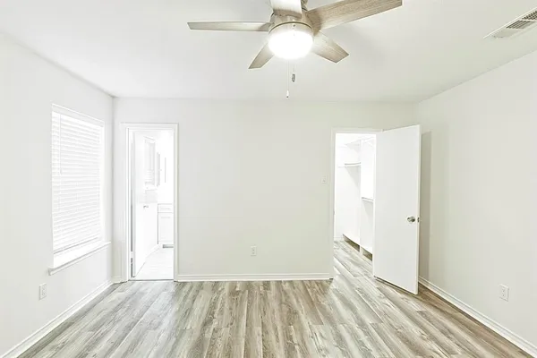 a view of room with window and hardwood floor