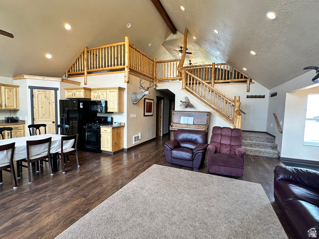 12 Crook Street Fish Haven, ID 83287 - Photo 17 of 35 Living room featuring a ceiling fan, recessed lighting, dark wood-type flooring, and vaulted ceiling