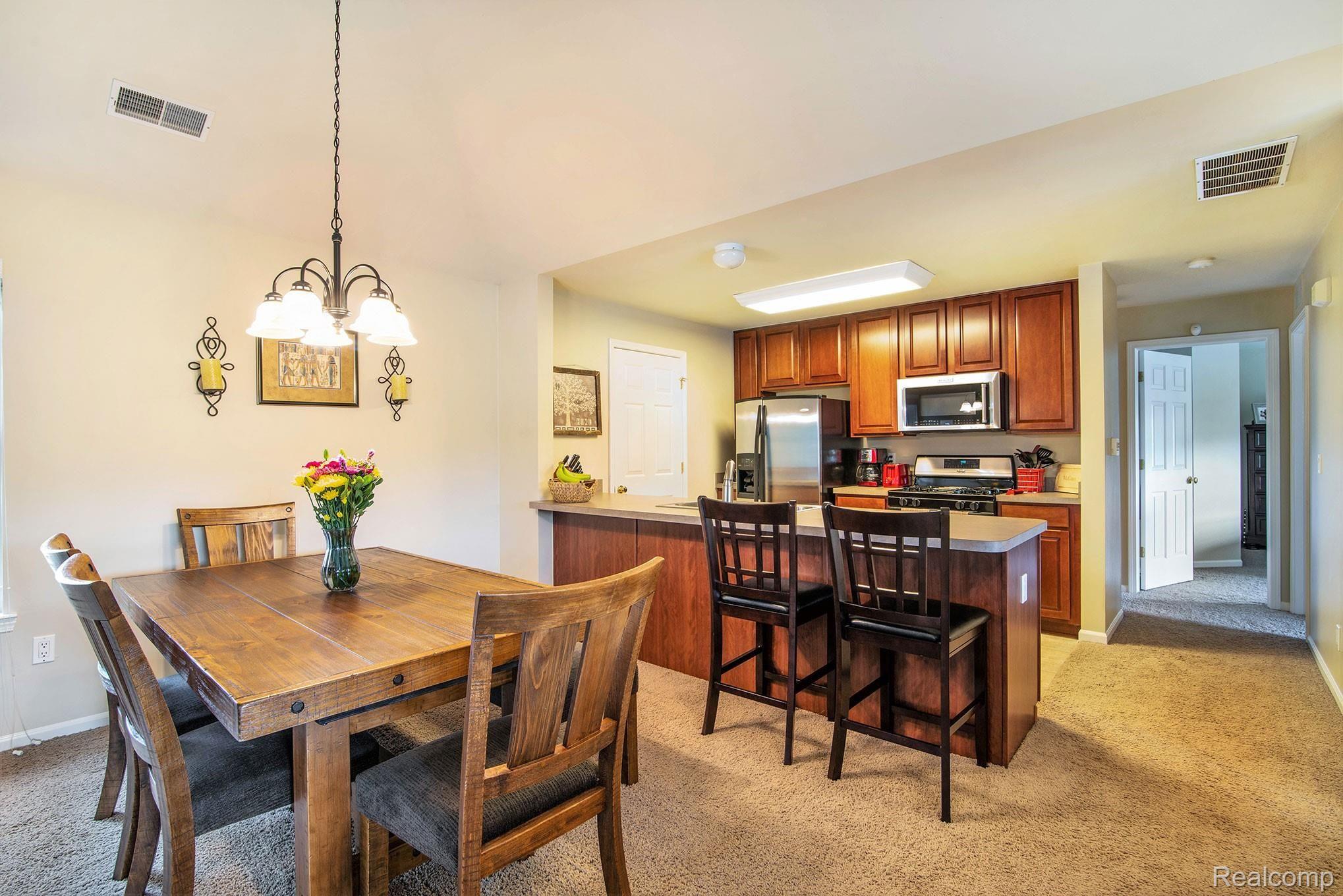 1123 Rial Lake Drive Howell, MI 48843 - Photo 6 of 19 Dining area and kitchen