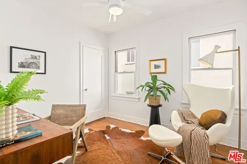 a bedroom with a bed and a couch