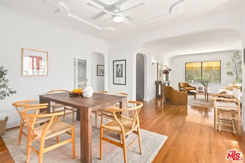 a view of a dining room with furniture and wooden floor