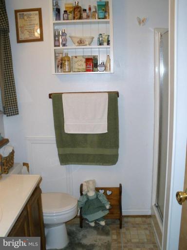 7002 Oliver Beach Road Middle River, MD 21220 - Photo 6 of 12 a bathroom with a toilet sink and mirror