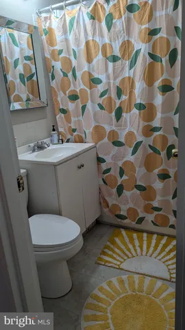 a bathroom with a toilet and a sink