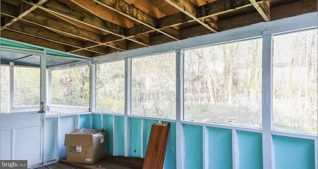 a view of a room with a large window