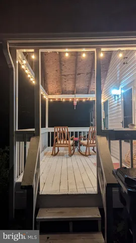 a view of a dining room with furniture and window