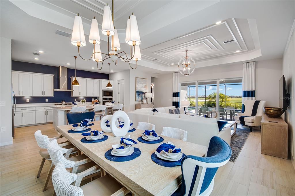 7165 Inlet Isles Lakewood Ranch, FL 34202 - Photo 10 of 26 a kitchen and a dining room with furniture