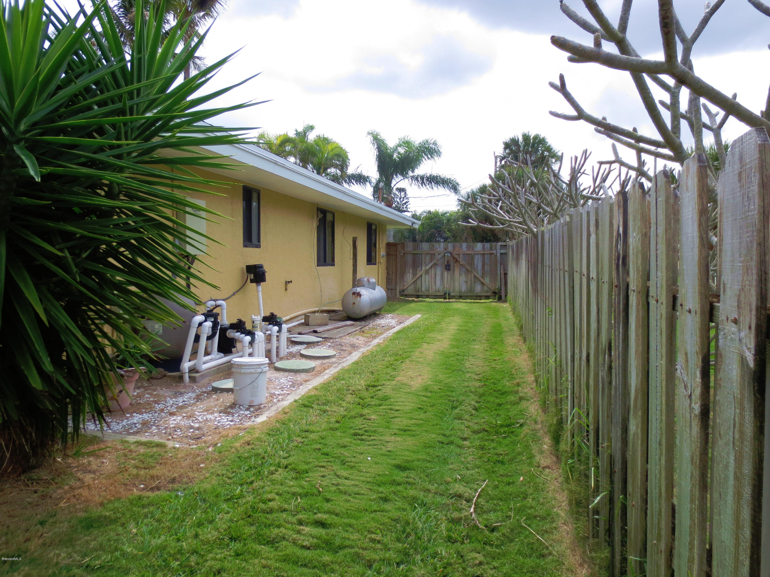 320 Riggs Avenue Melbourne Beach, FL 32951 - Photo 18 of 24 Side Yard 1