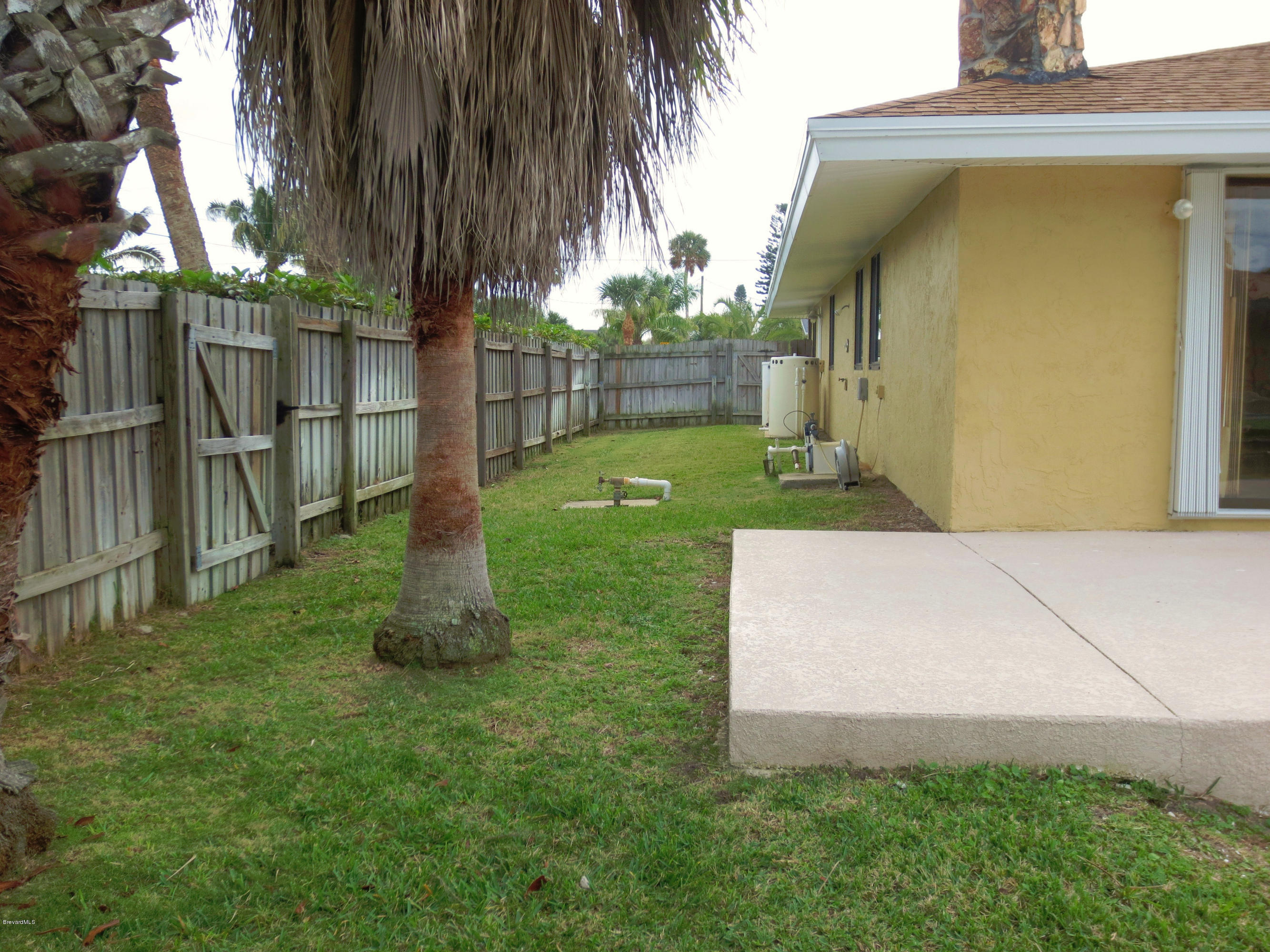 320 Riggs Avenue Melbourne Beach, FL 32951 - Photo 19 of 24 Side Yard 2