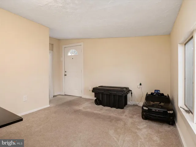 a room with a bed and a car