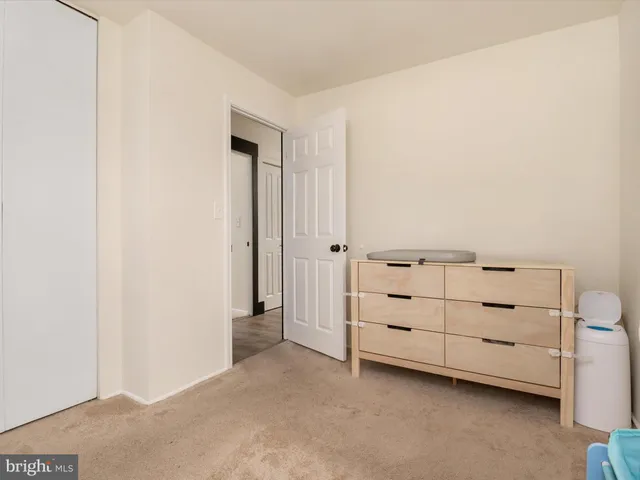 a view of an empty room and cabinet