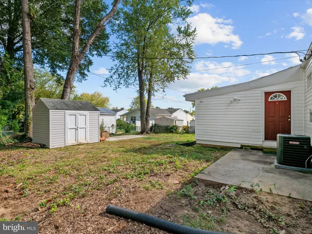 a front view of house with yard and outdoor seating