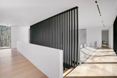 a view of a livingroom with furniture and stairs