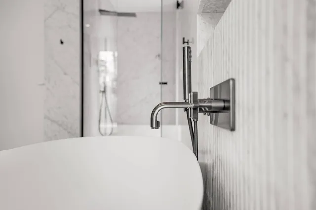 a bedroom with a bed and a table