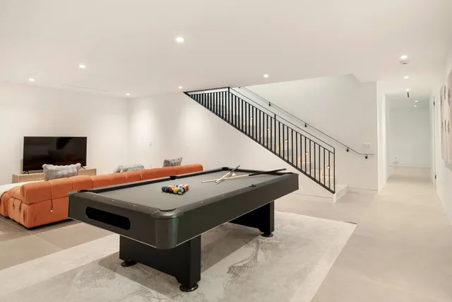 a room with furniture and flat screen tv