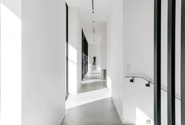 a view of a bathroom from a hallway