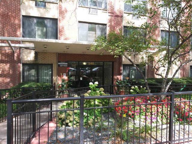 540 West Roscoe Street, Unit 387 Chicago, IL 60657 - Photo 1 of 5 a view of house with outdoor seating and flowers