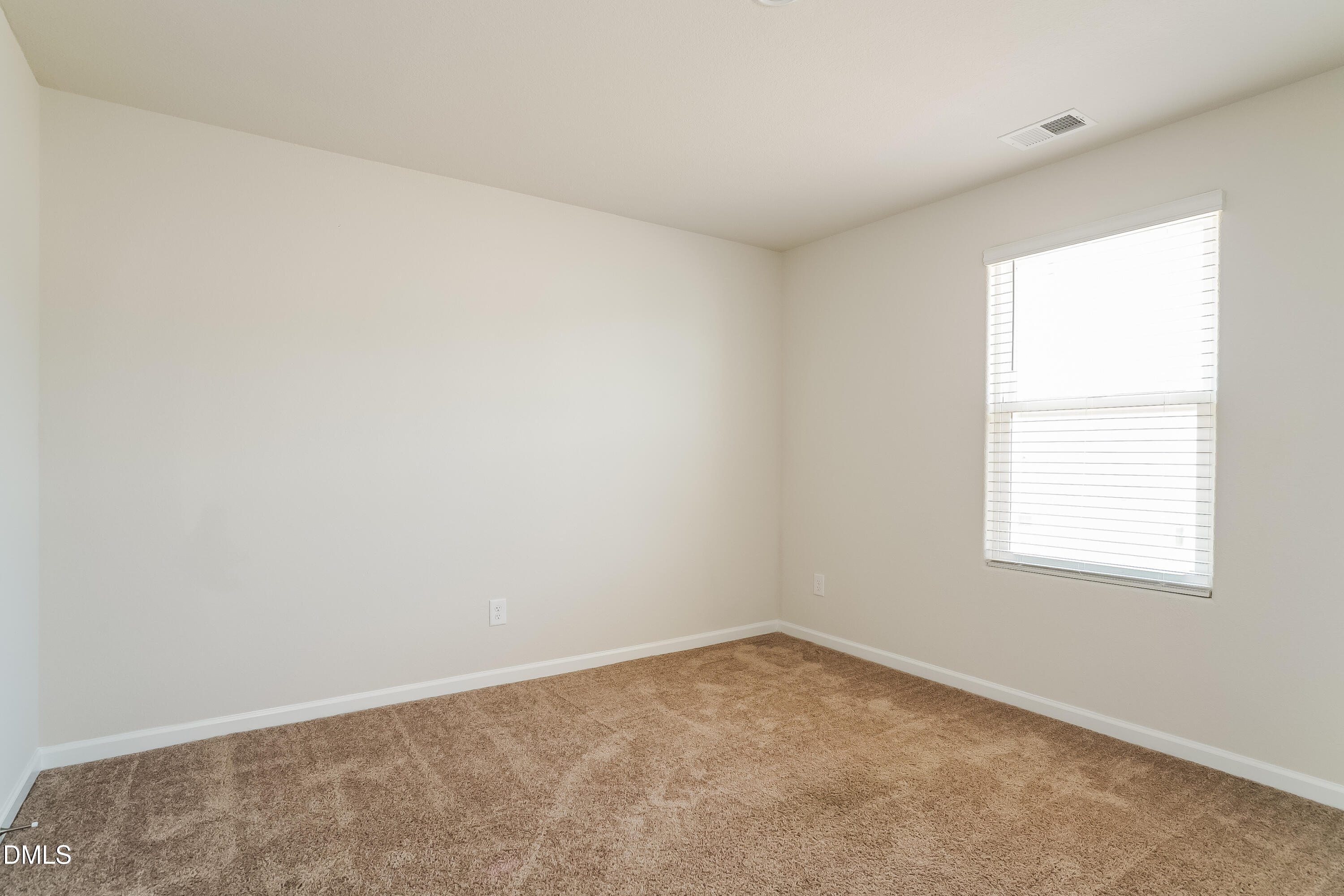 300 Gourd Street Zebulon, NC 27597 - Photo 12 of 17 an empty room with a window
