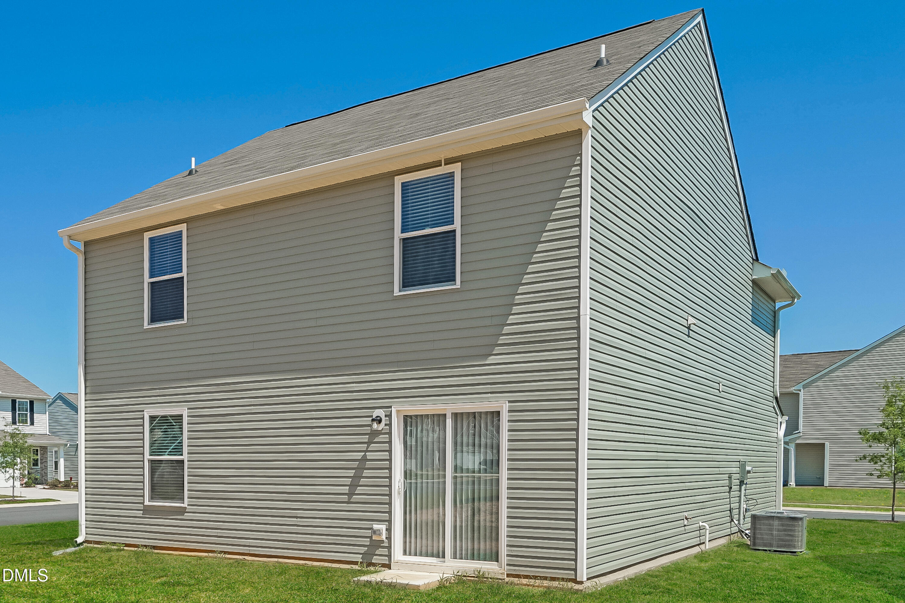300 Gourd Street Zebulon, NC 27597 - Photo 15 of 17 a front view of a house with a yard and garage