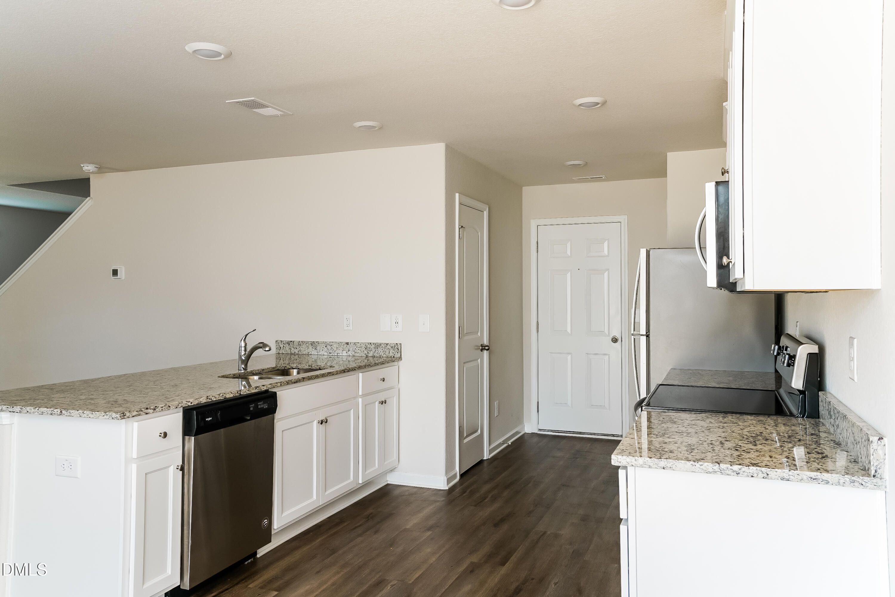 300 Gourd Street Zebulon, NC 27597 - Photo 6 of 17 a kitchen with a sink stove and cabinets