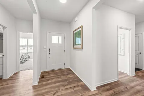 wooden floor in a hall with an entryway space