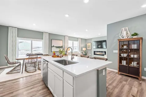 a view of a kitchen counter space a sink and appliances