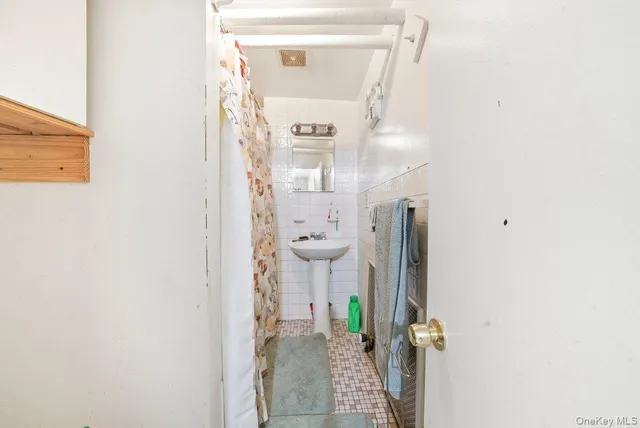 a view of an empty room and wooden floor