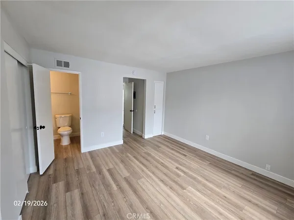a view of an empty room and glass door