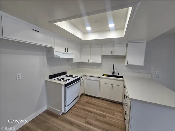 a kitchen with stainless steel appliances granite countertop a stove and a sink