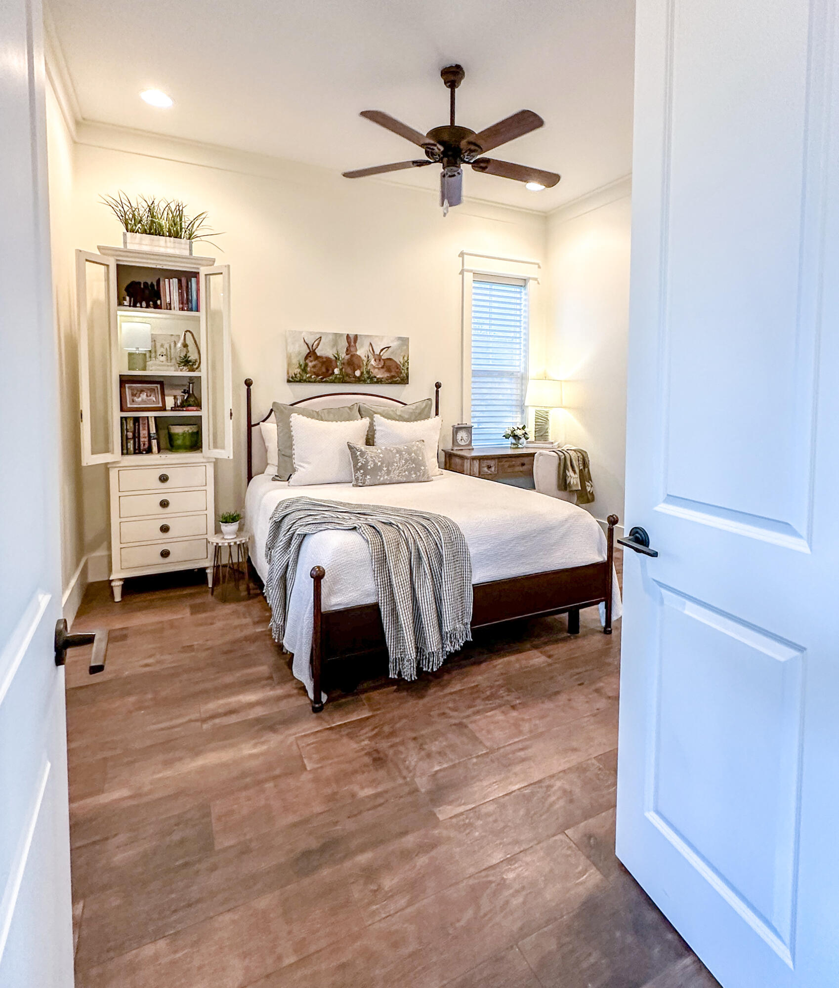 239 Matt's Way Santa Rosa Beach, FL 32459 - Photo 14 of 44 a spacious bedroom with a bed a window and a chandelier