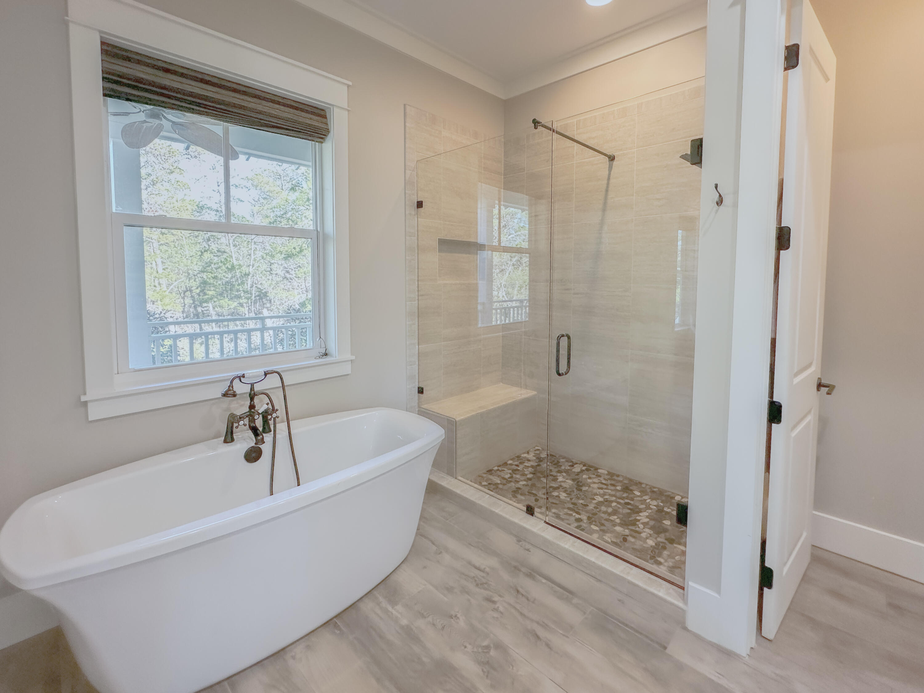 239 Matt's Way Santa Rosa Beach, FL 32459 - Photo 21 of 44 a bathroom with a bathtub and a shower
