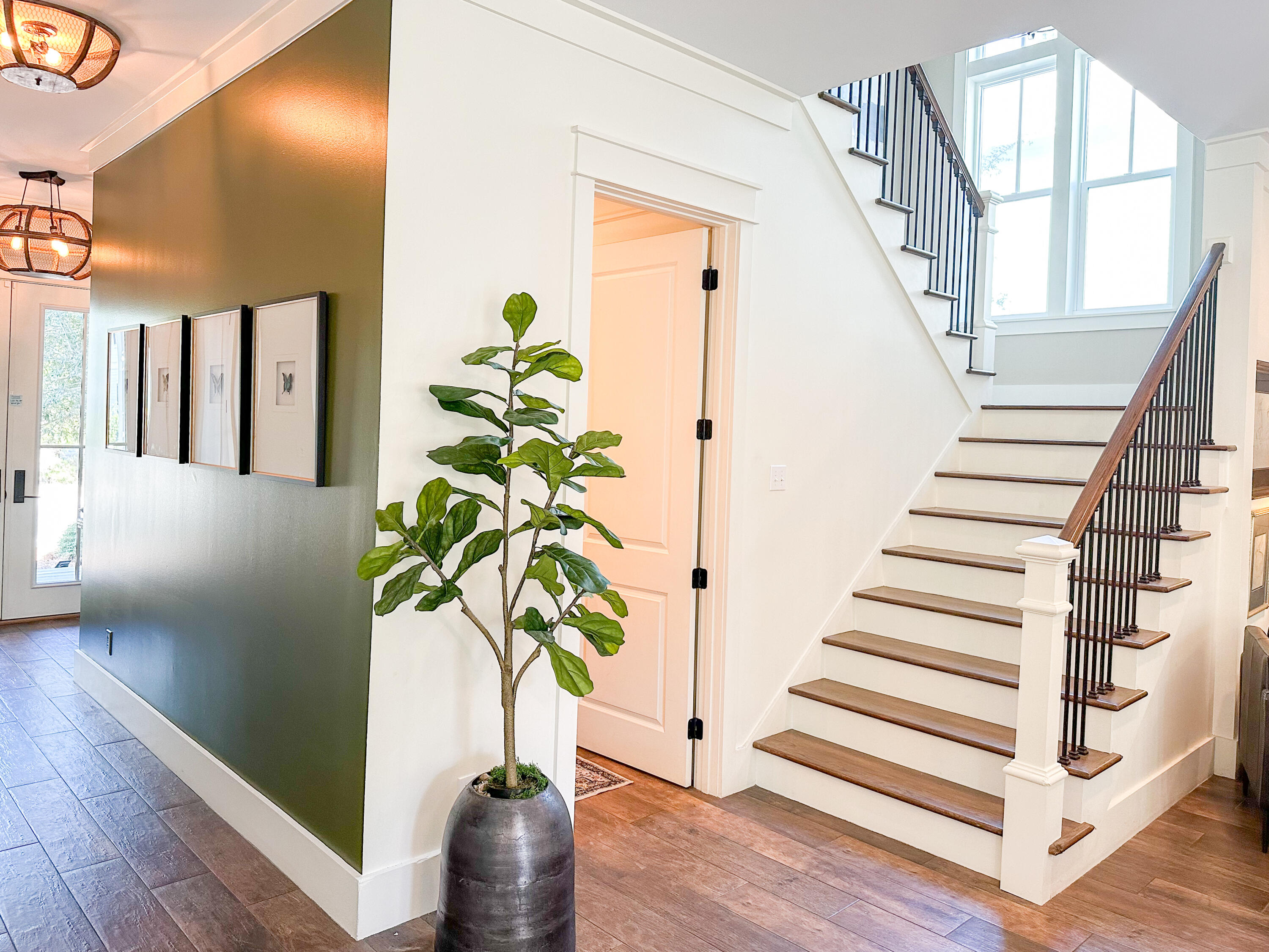 239 Matt's Way Santa Rosa Beach, FL 32459 - Photo 5 of 44 a view of staircase with wooden floor and plant