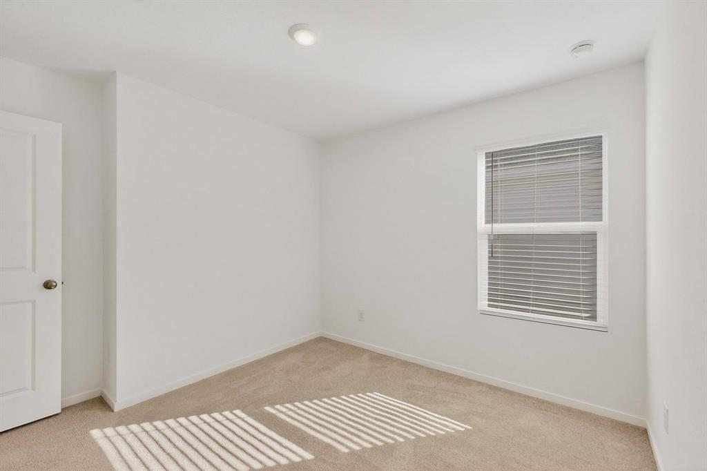 6734 Highlands Street Princeton, TX 75407 - Photo 16 of 40 a view of an empty room and a window
