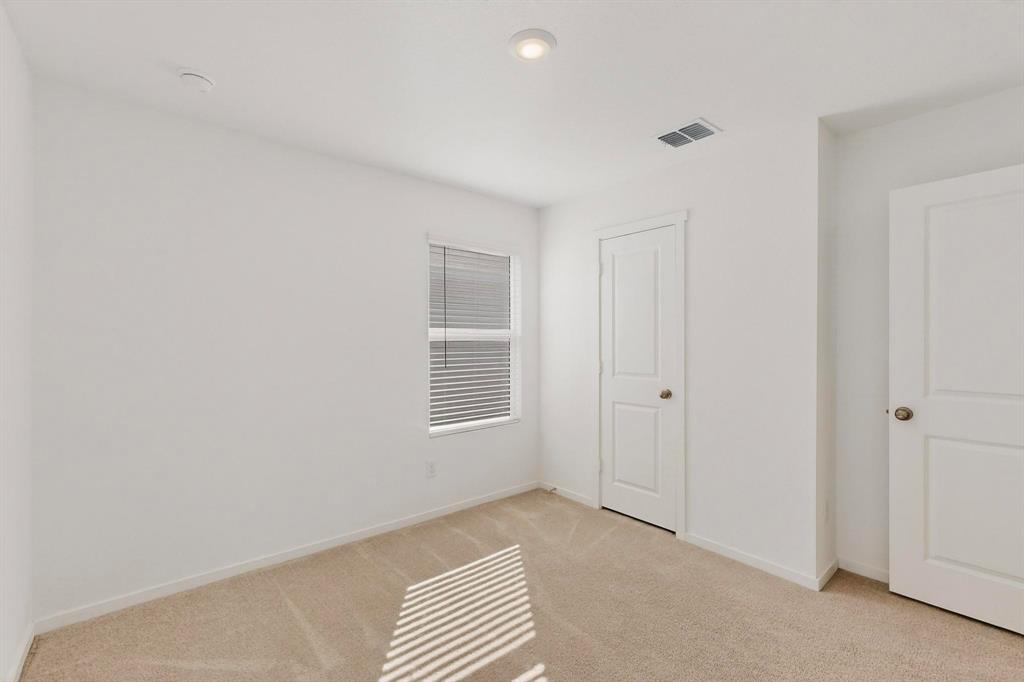 6734 Highlands Street Princeton, TX 75407 - Photo 19 of 40 a view of an empty room with a window