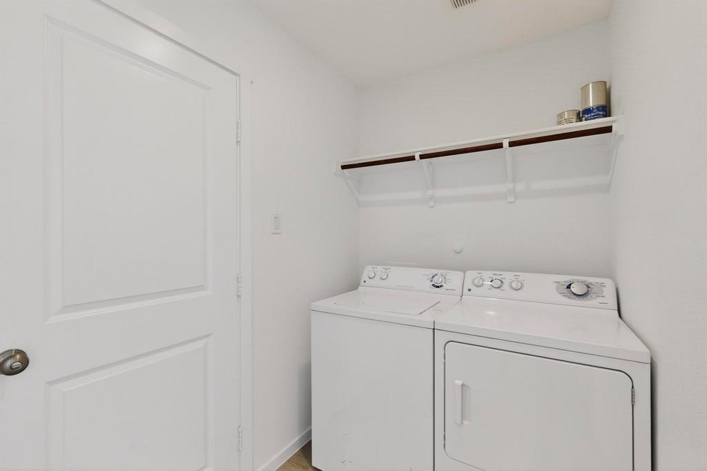 6734 Highlands Street Princeton, TX 75407 - Photo 21 of 40 a utility room with dryer and washer
