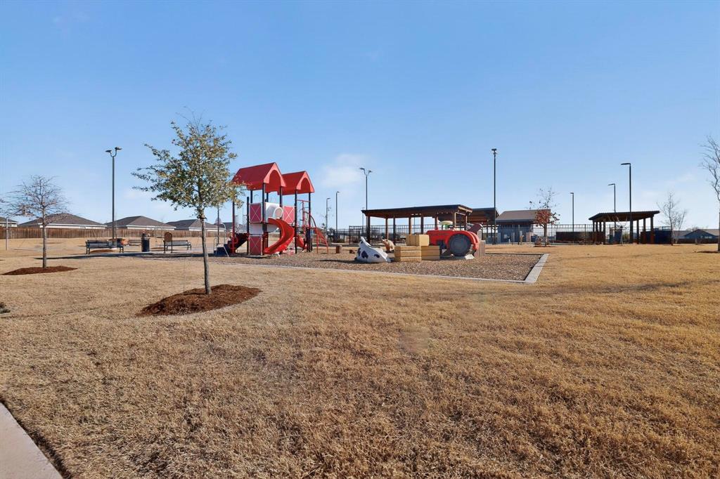 6734 Highlands Street Princeton, TX 75407 - Photo 30 of 40 a group of cars parked in front of building