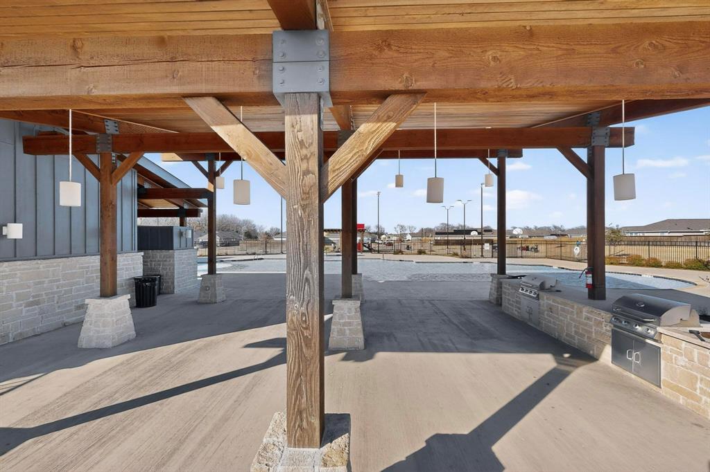 6734 Highlands Street Princeton, TX 75407 - Photo 34 of 40 a view of a swimming pool with a porch