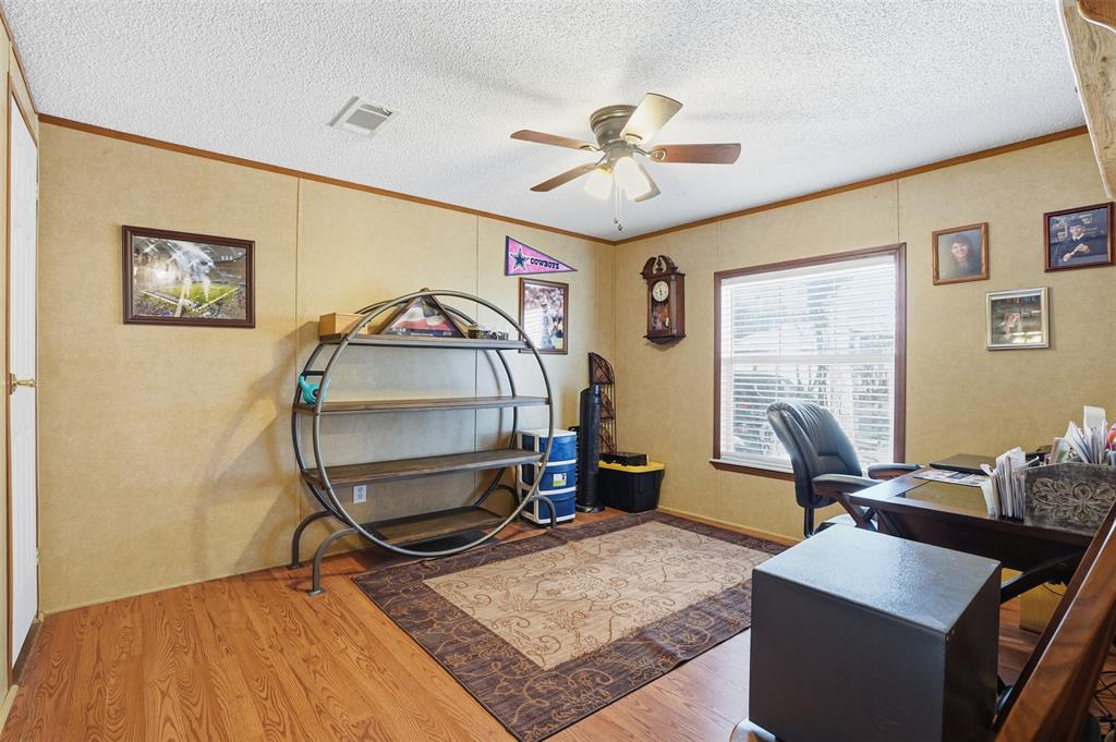 224 Cactus Ridge Court Springtown, TX 76082 - Photo 22 of 39 Secondary bedroom with crown molding and a ceiling fan