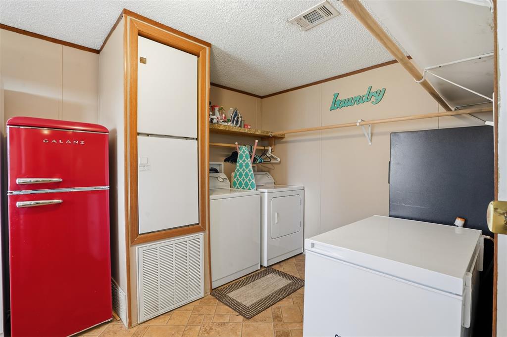 224 Cactus Ridge Court Springtown, TX 76082 - Photo 24 of 39 Large Laundry area with room for full size washer, dryer, freezer and refrigerator