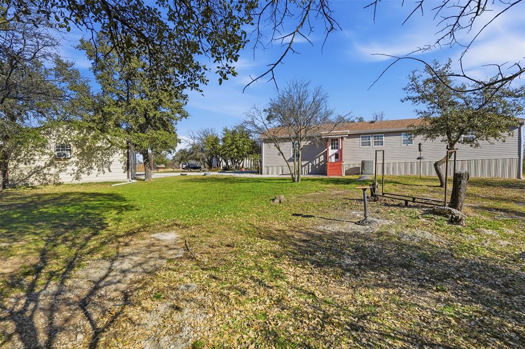 224 Cactus Ridge Court Springtown, TX 76082 - Photo 31 of 39 View of backyard