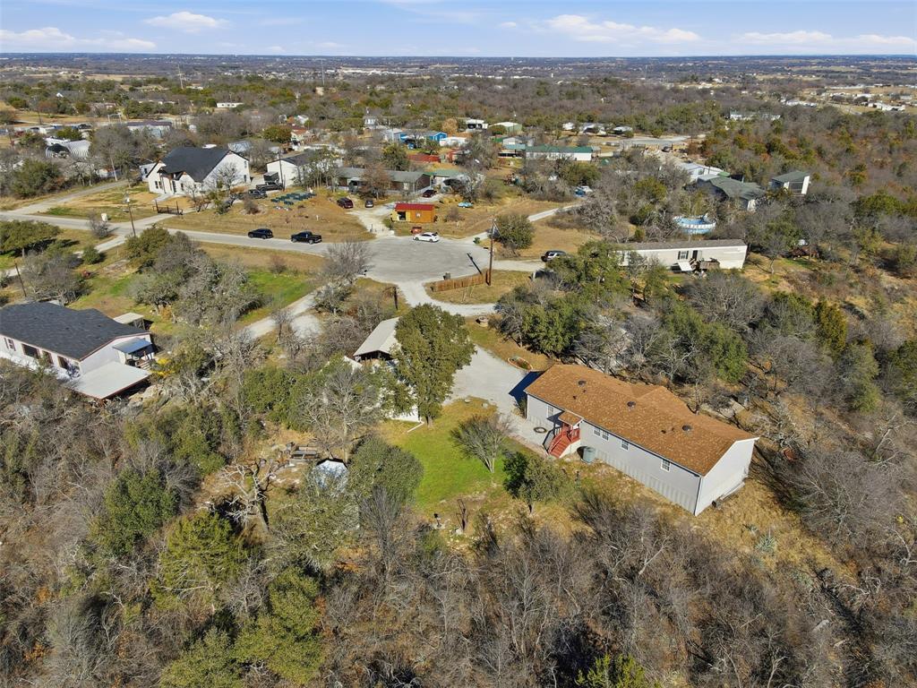 224 Cactus Ridge Court Springtown, TX 76082 - Photo 35 of 39 Aerial overview of property's location with nearby suburban area