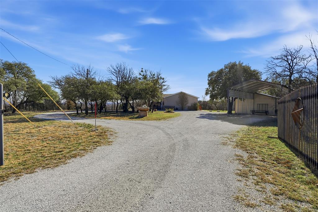 224 Cactus Ridge Court Springtown, TX 76082 - Photo 4 of 39 Circle gravel driveway