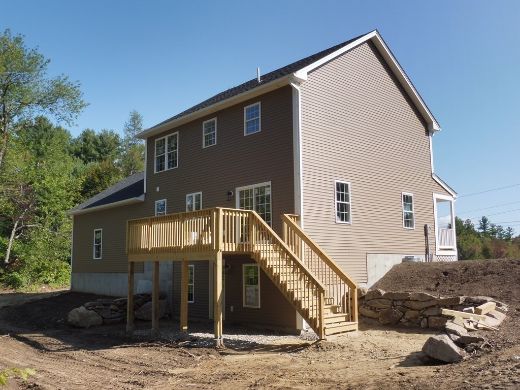 9 Depot Road Ashburnham, MA 01430 - Photo 15 of 16 a front view of a house with a yard