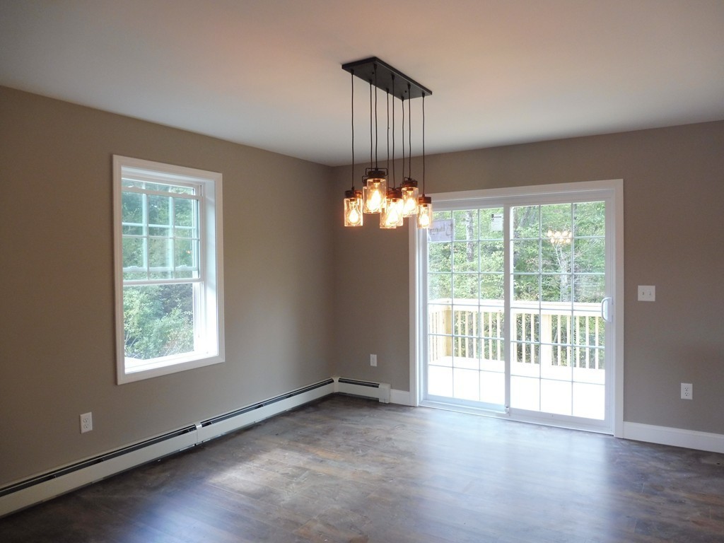 9 Depot Road Ashburnham, MA 01430 - Photo 4 of 16 a view of an empty room with a window