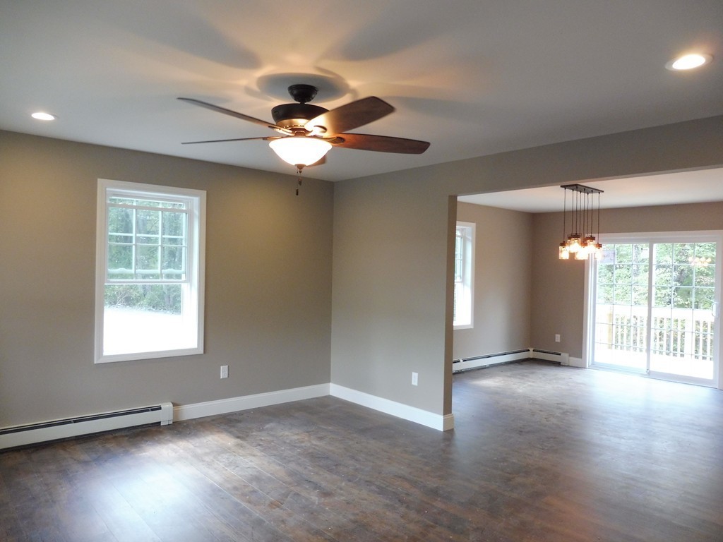 9 Depot Road Ashburnham, MA 01430 - Photo 6 of 16 a view of an empty room with wooden floor and a window