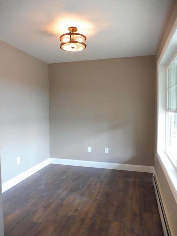 9 Depot Road Ashburnham, MA 01430 - Photo 8 of 16 en empty room with windows and ceiling fan
