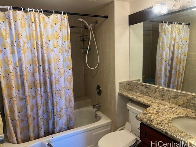 3130 Ala Ilima Street, Unit 10C Honolulu, HI 96818 - Photo 8 of 11 a bathroom with a granite countertop sink and a mirror