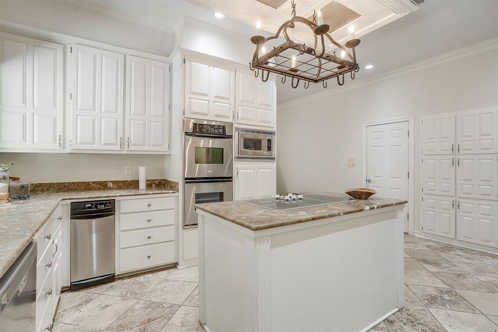 1805 Burton Hill Road Fort Worth, TX 76107 - Photo 11 of 39 a kitchen with stainless steel appliances granite countertop a sink a stove a microwave a counter space and cabinets